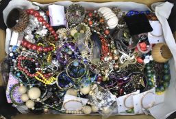 Assorted costume jewellery including bangles, necklaces, and more.
