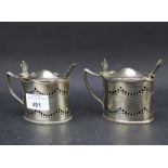Two silver plated mustard pots.