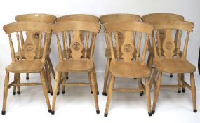 A set of eight pine kitchen chairs.