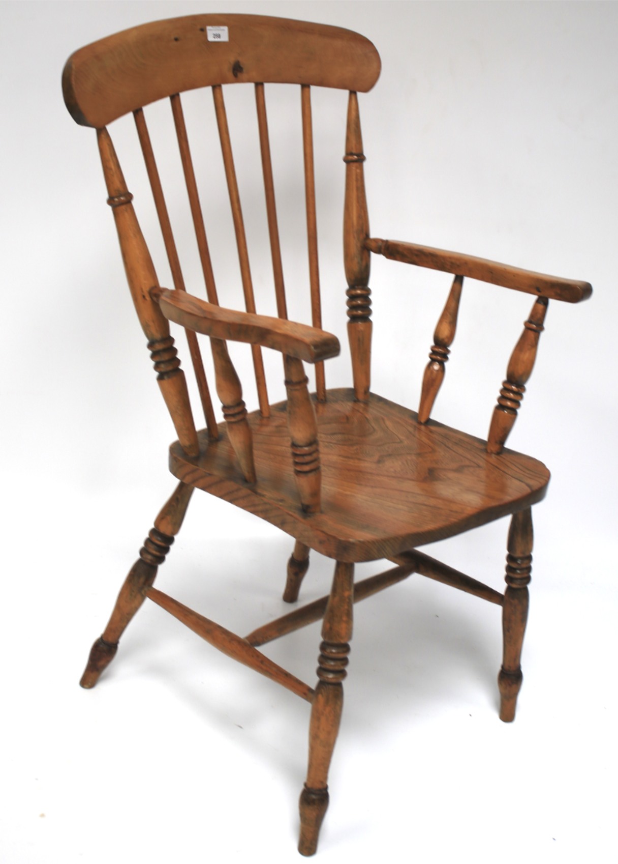 An elm seated Windsor chair.