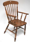 An elm seated Windsor chair.