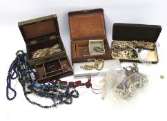 An assortment of vintage and modern costume jewellery.