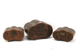 Three 20th century Chinese carved wooden boxes.