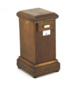 A 19th century money box, the mahogany case with a sliding drawer to the top, raised on bun feet,