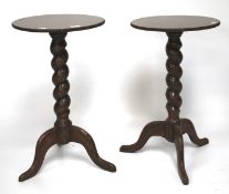 A pair of mahogany occasional barley twist tables.