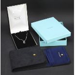 A Pandora style silver pendant on chain and a Tiffany necklace pouch in box