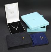 A Pandora style silver pendant on chain and a Tiffany necklace pouch in box