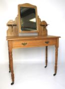 A 20th century satin walnut dressing table.