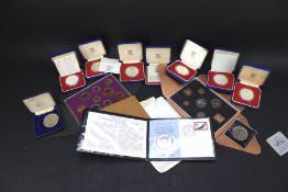 An assortment of silver and other commemorative coins.