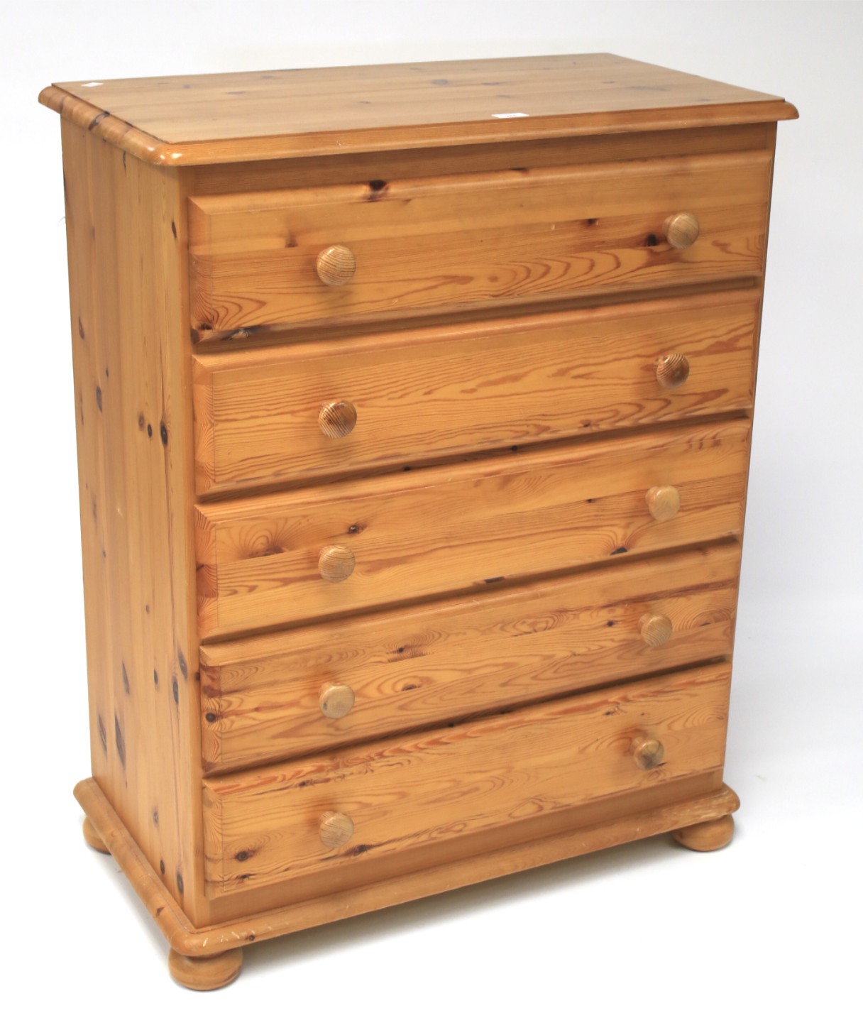 A contemporary pine chest of five long drawers.