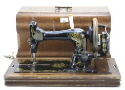 A singer sewing machine, model #832909 with case.