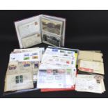 A collection of postcards and First Day covers.