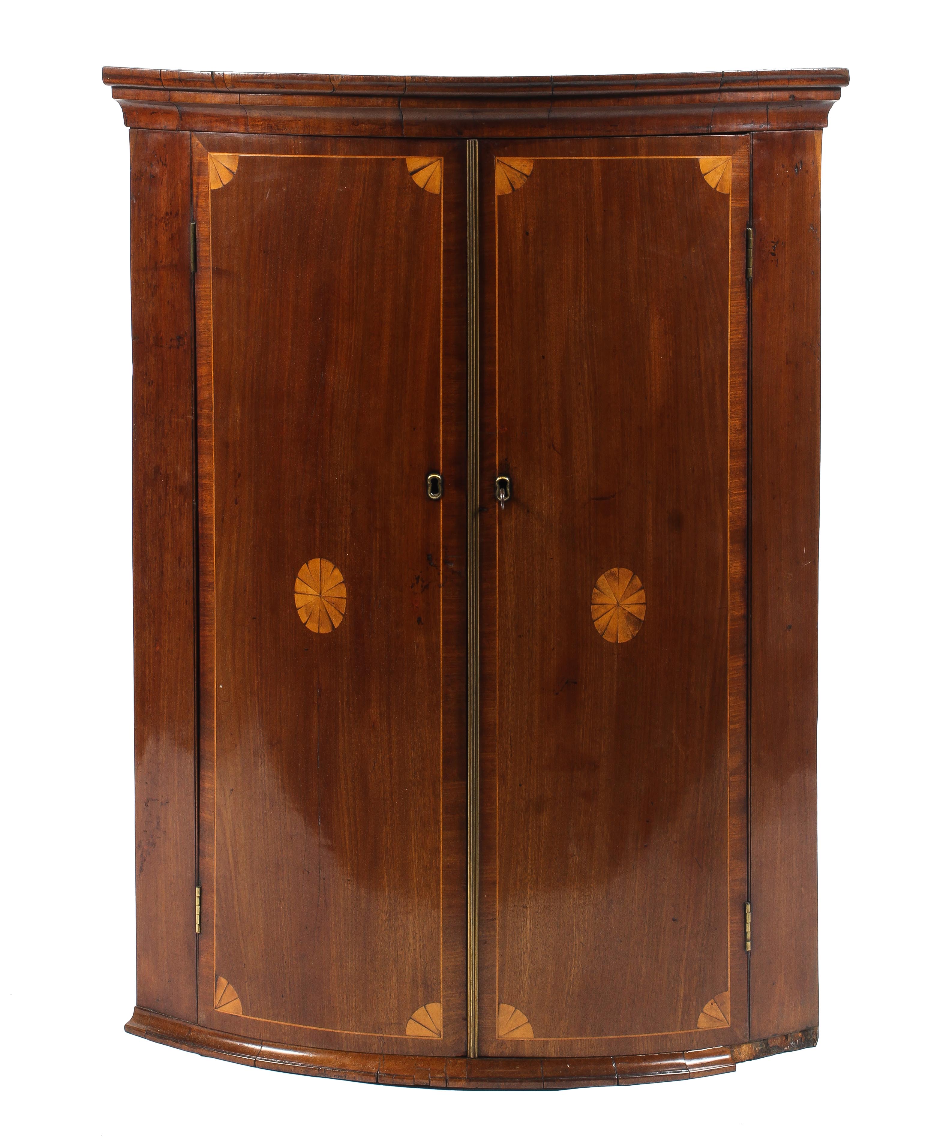 A Georgian mahogany corner cupboard.