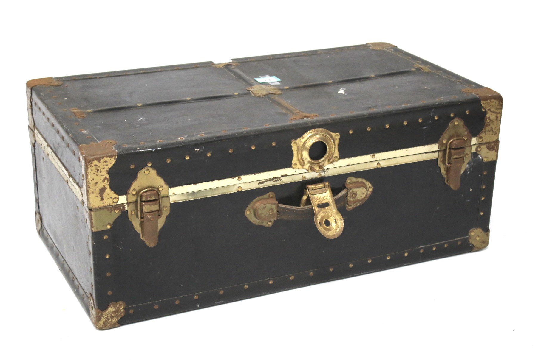 A leatherette and metal bound travelling trunk.