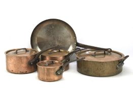Four copper Mauyiel pans and a saucepan. One with a double handle, largest diam.