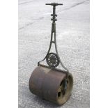 A Victorian garden roller with central round motif pierced with a flower basket.