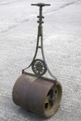 A Victorian garden roller with central round motif pierced with a flower basket.