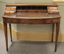 A ladies reproduction bow fronted mahogany writing desk.