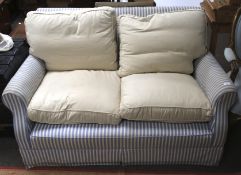 An early 20th century two-seater sofa.
