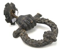 An early 19th century cast metal door knocker.