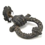 An early 19th century cast metal door knocker.