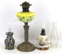 Two ceramic table lamps and an oil lamp.