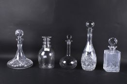 Five cut glass decanters.