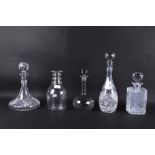 Five cut glass decanters.