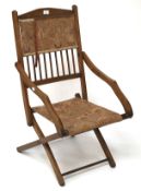 An early 20th century mahogany folding chair.