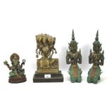 Four Asian figures.