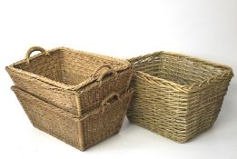 Four large wicker baskets.