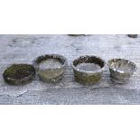 Three stone pots and horse tether with ring.