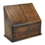 An early 20th century oak stationery box letter holder.