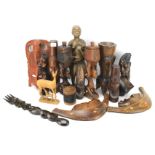 An assortment of African carved wooden tribal figures.