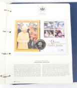 A folder containing The Queen's Golden Jubilee Coin First Day covers