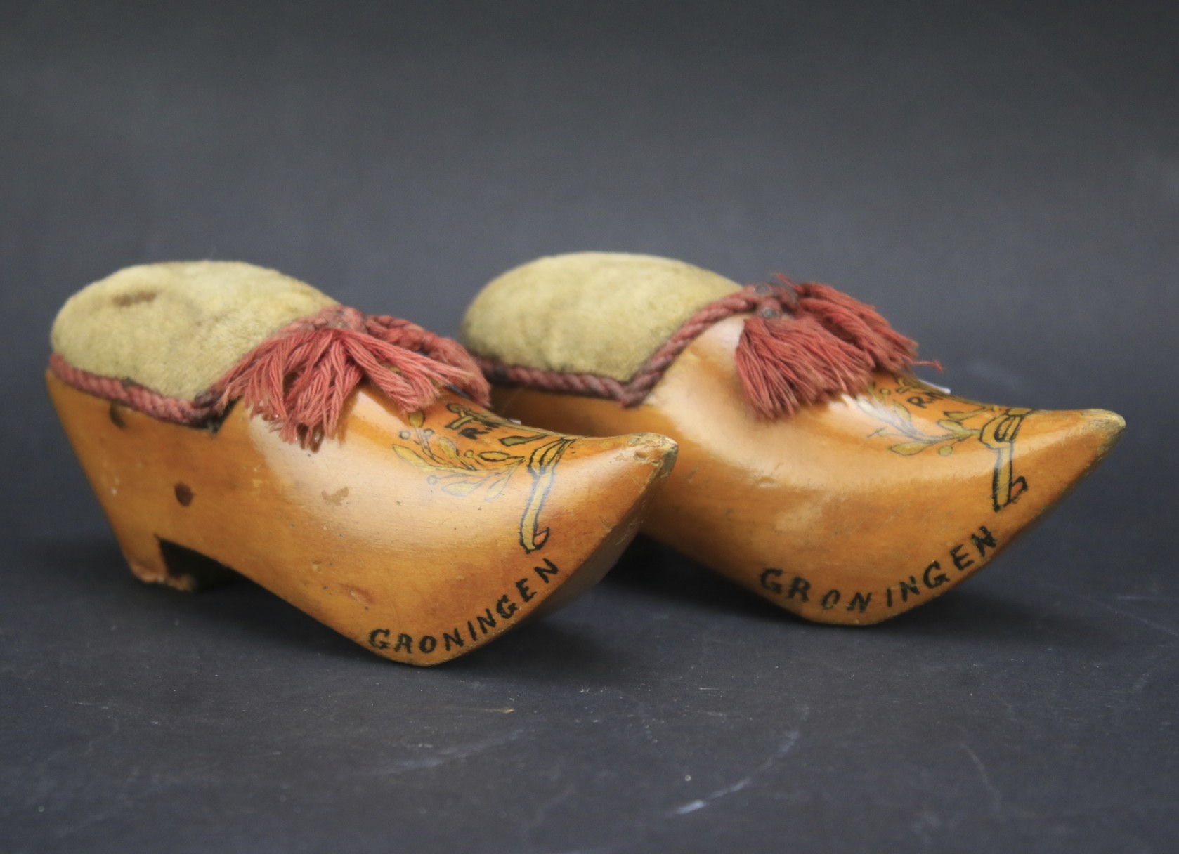 A pair of Dutch treen pin cushions.