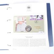 A folder containing The Queen's Golden Jubilee Coin Cover Collection