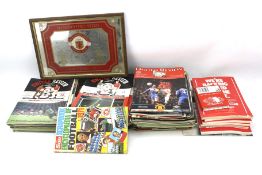 A collection of football programmes.