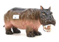 An early 20th century continental porcelain figure of a hippo.