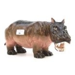 An early 20th century continental porcelain figure of a hippo.