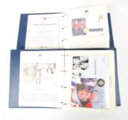 Two folders containing The Queen's Golden Jubilee Commemorative Coin Cover Collection.