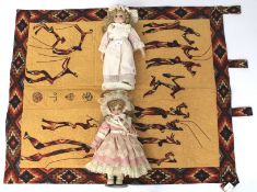 Two porcelain limbed collectors dolls on stands.