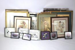 A large collection of needlework pictures.