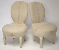 A pair of small upholstered chairs.