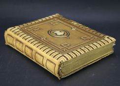 A Victorian leather bound photograph album.