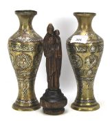 A pair of brass vases and an 18th century wooden carving of the virgin and child.