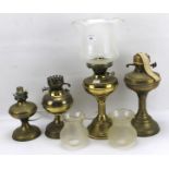 Four 20th century oil lamps.