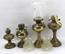 Four 20th century oil lamps.