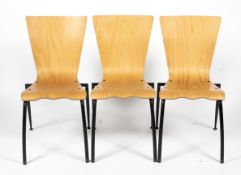 Three retro bent wood stacking kitchen chairs.