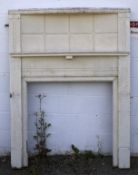 A large white painted fire surround.